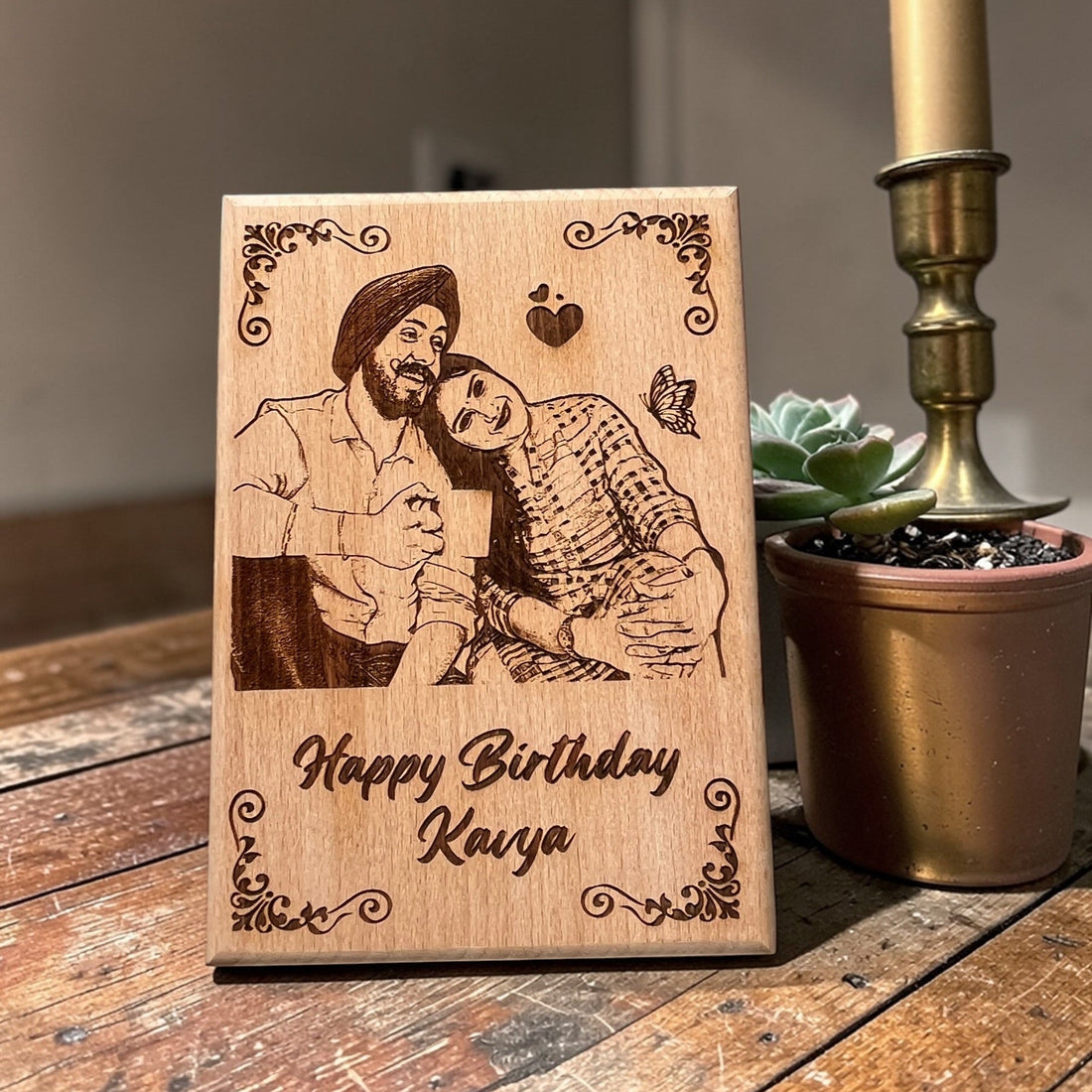 Personalised wooden photo frame on a table
