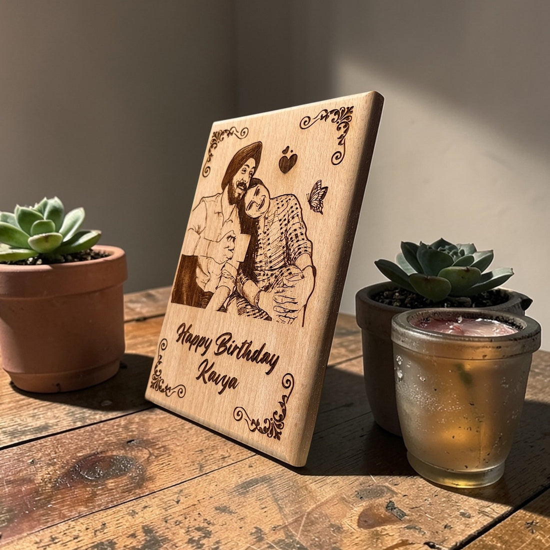 Wooden photo frame displayed beside plants